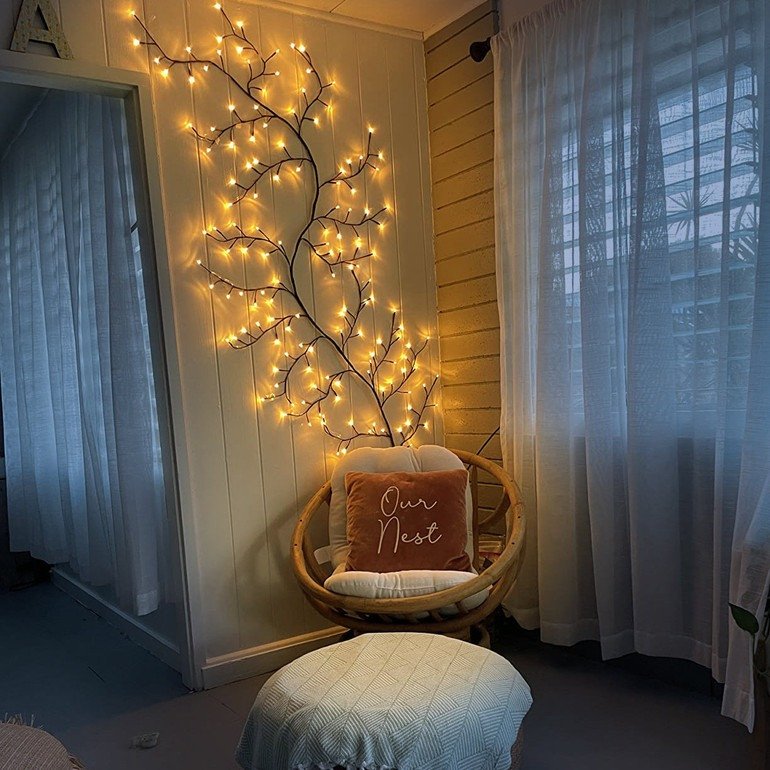 Enchanted Willow Vine arranged around an interior archway with glowing lights