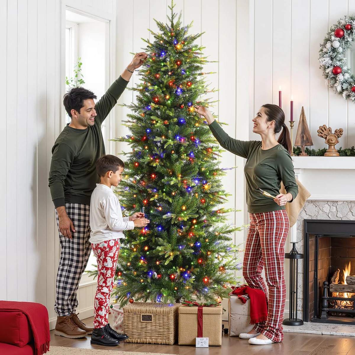 Two adults and a child decorating a Christmas tree with multicolor lights